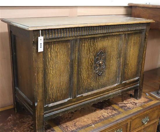 A 1920s panelled oak coffer W.92cm